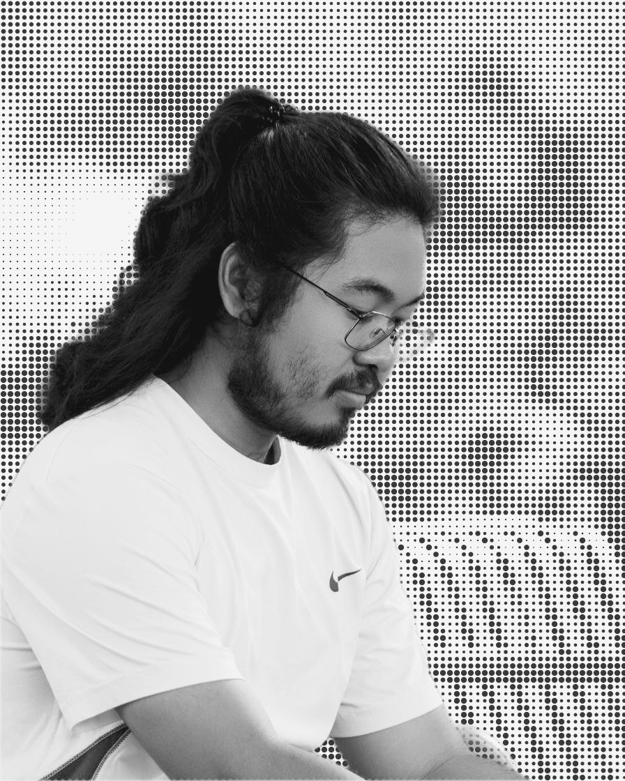 Black-and-white portrait of Kyaw Wunna Htun looking down, against a dot-pattern background